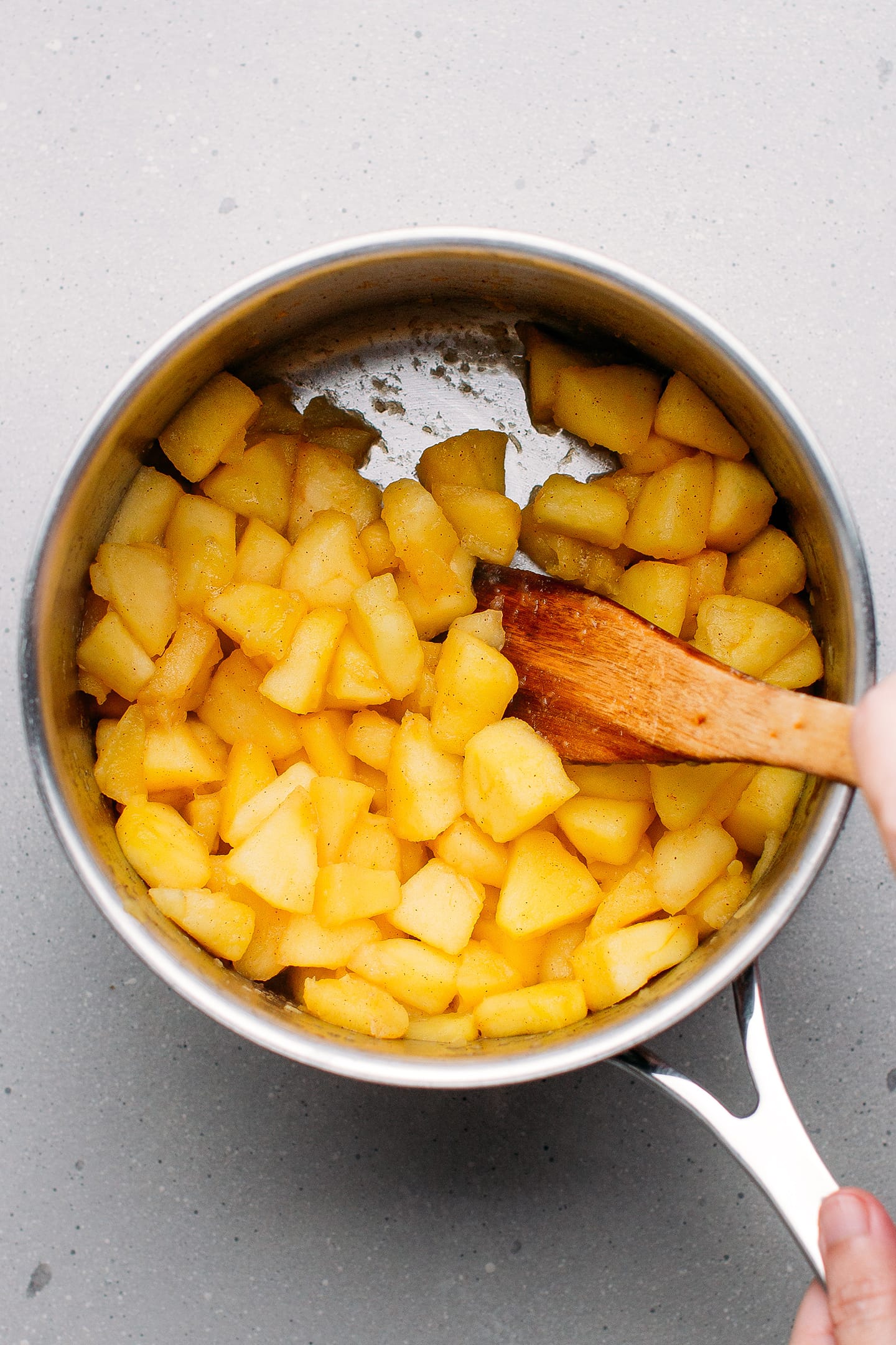 Sautéed apples in a saucepan.