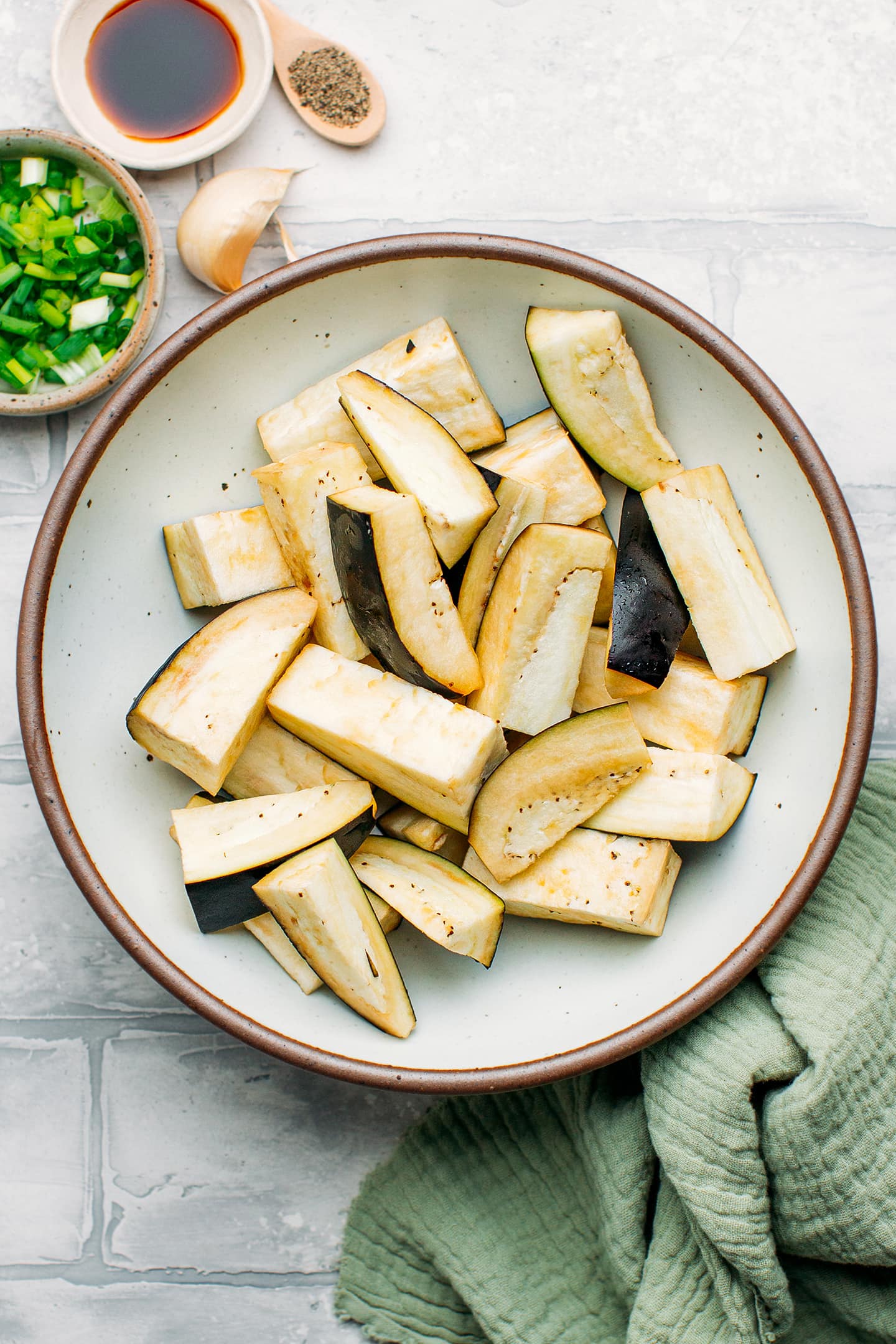 Sliced eggplants in a bowl.