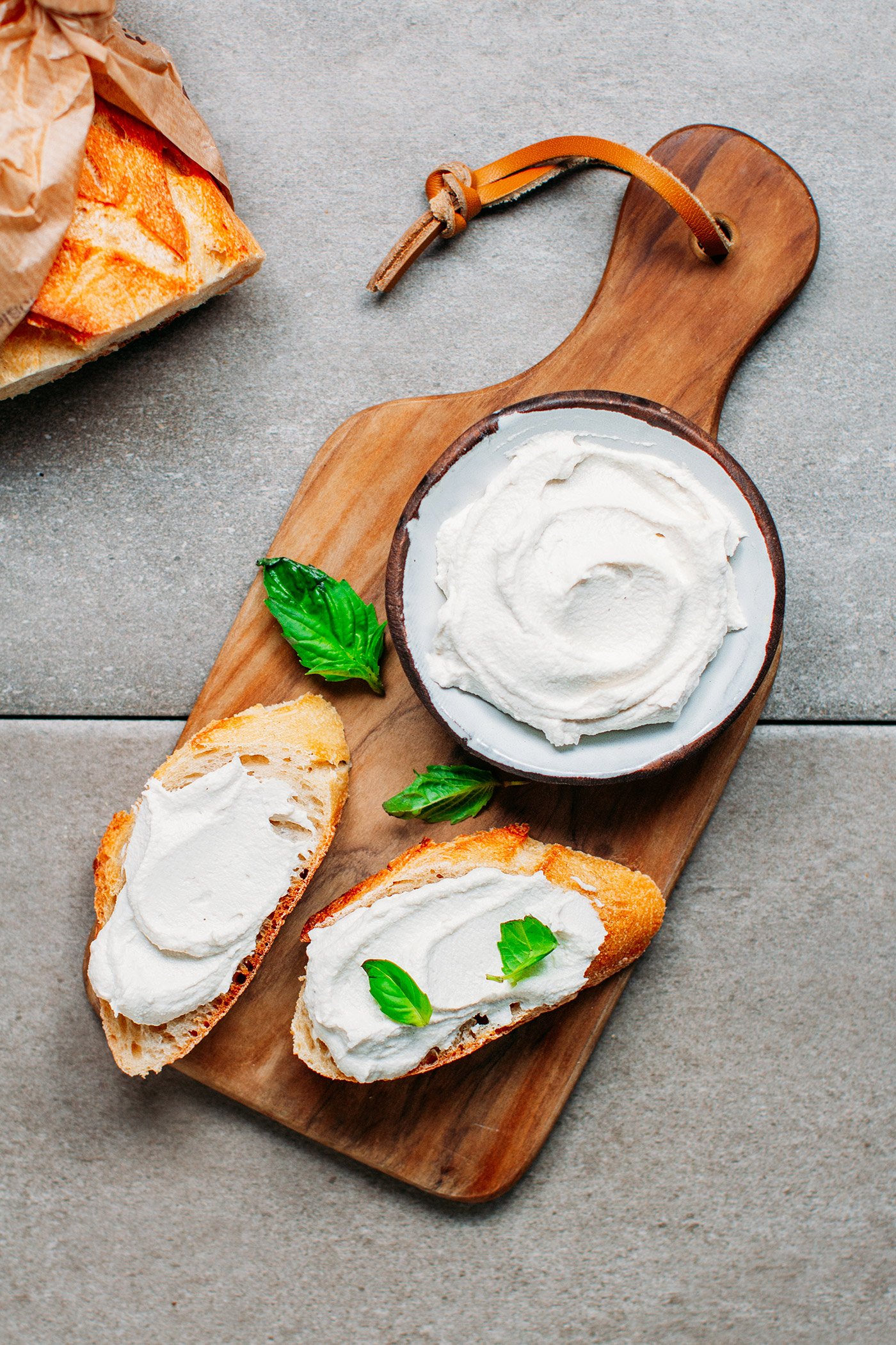 Vegan cream cheese on bread slices