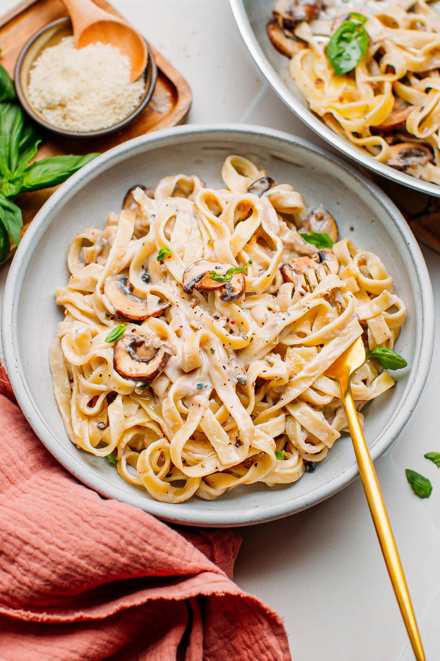 Mushroom pasta with peppercorn sauce on a plate.