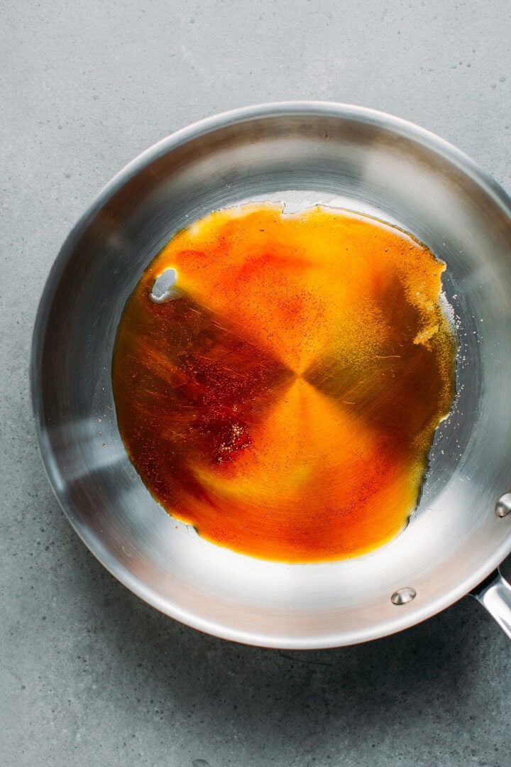 Making caramel in a skillet.