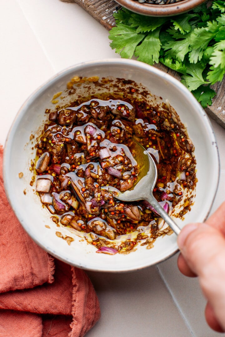 Balsamic vinegar vinaigrette in a small bowl.