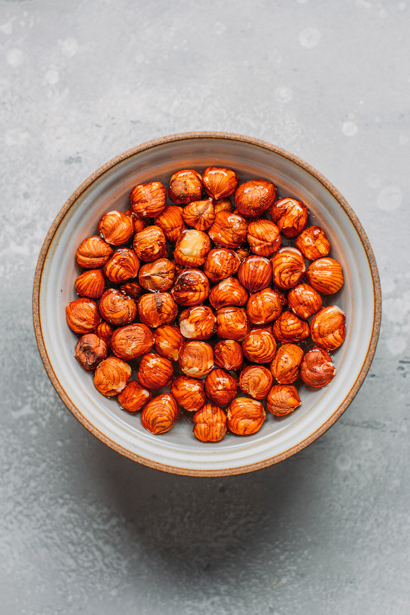 Raw hazelnuts soaking in water