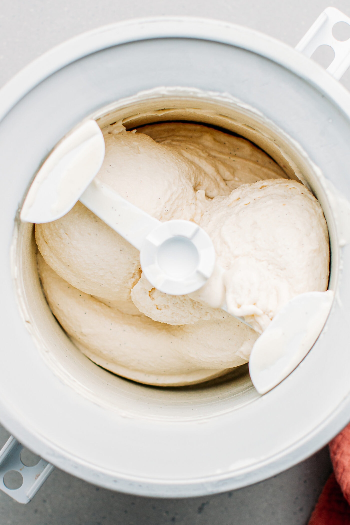 Churning vanilla ice cream in an ice cream maker.