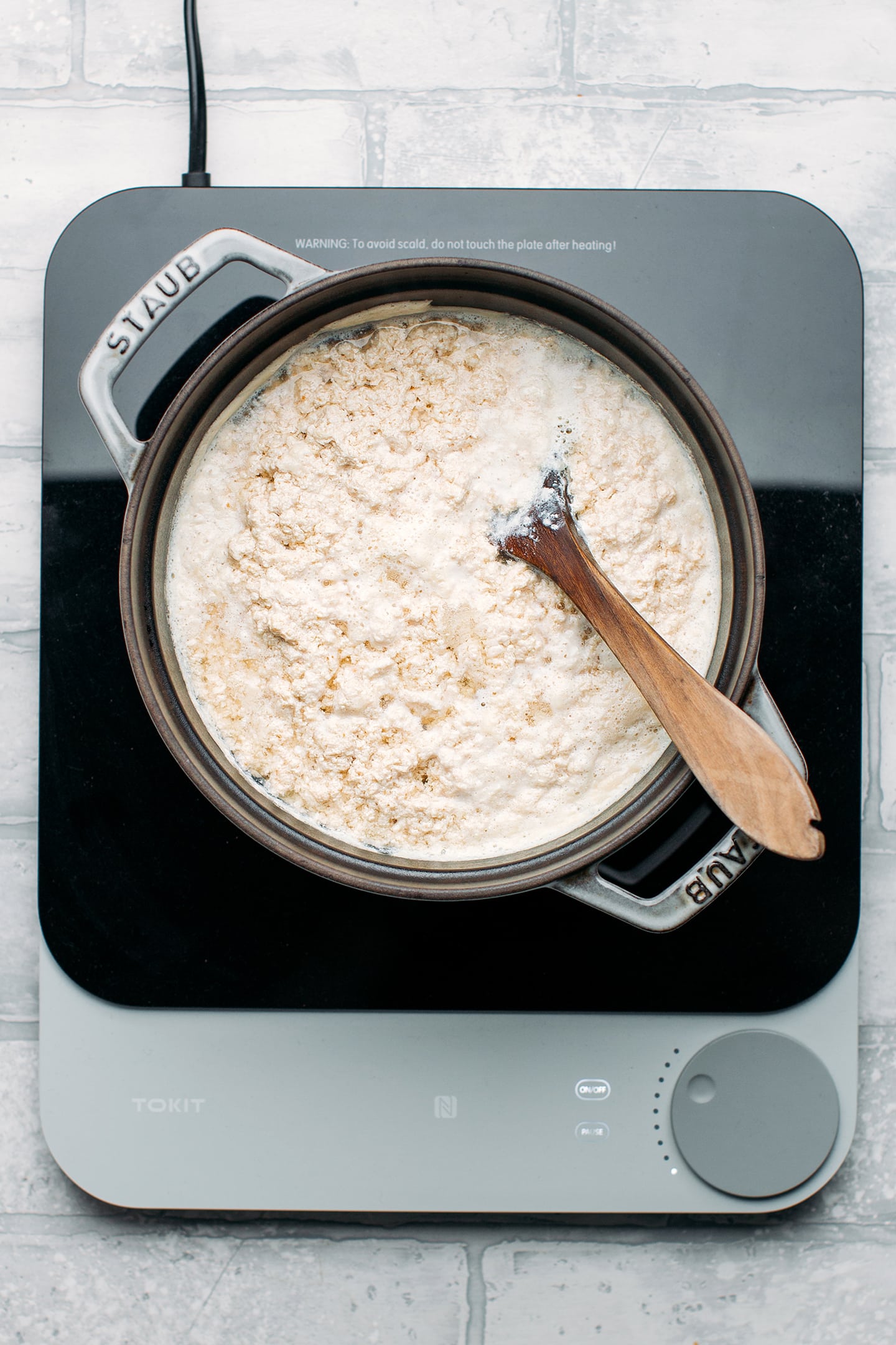 Curdled soy milk in a pot.