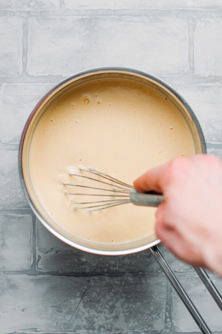 Whisking vegan fondue.