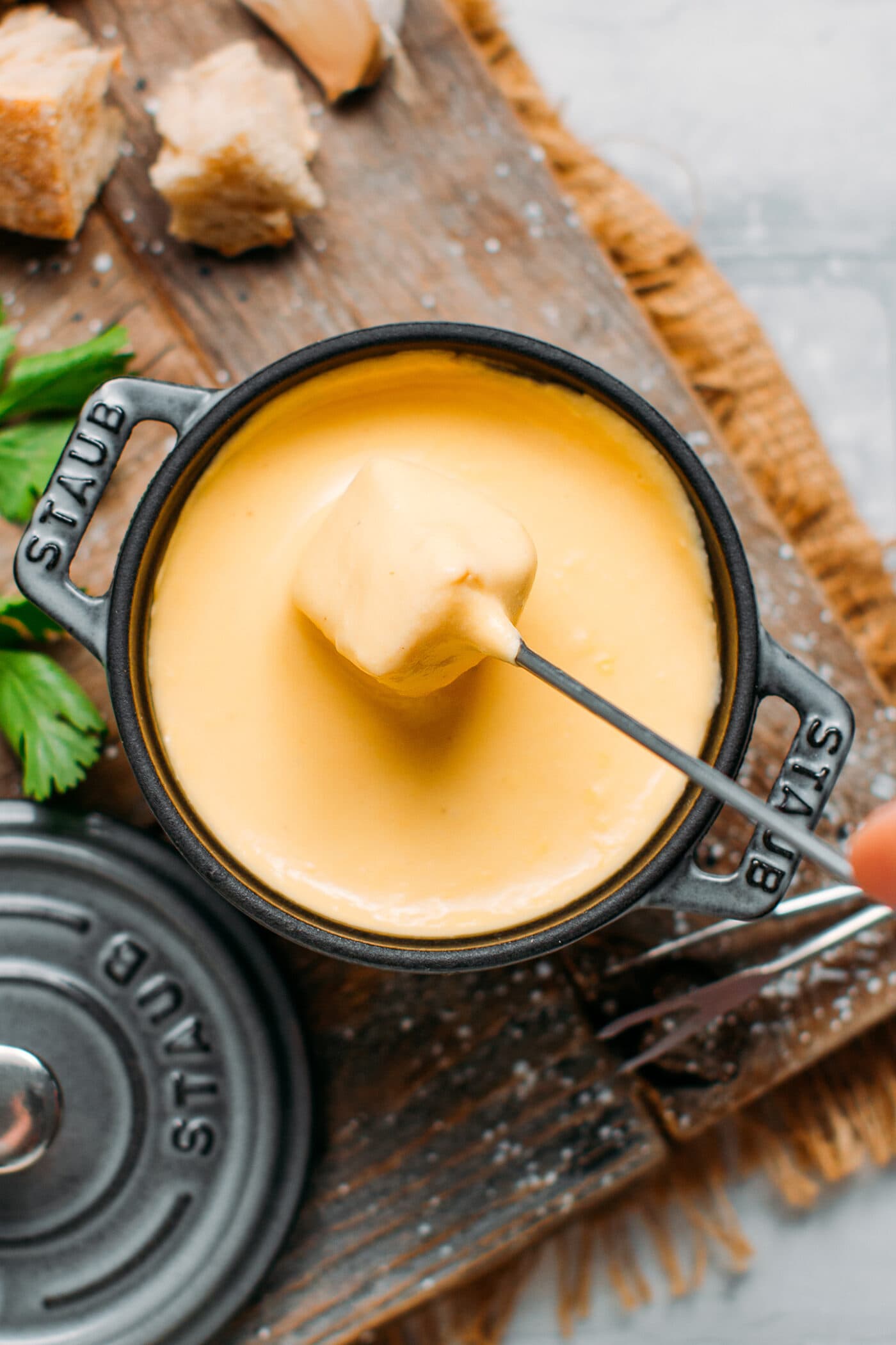 Dipping bread into vegan fondue.