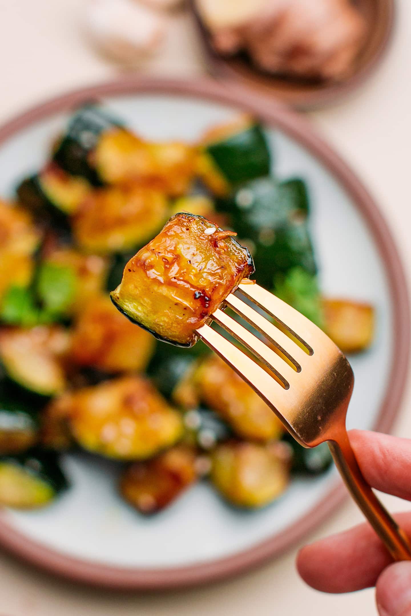 Close-up of a chunk of marinated zucchini.