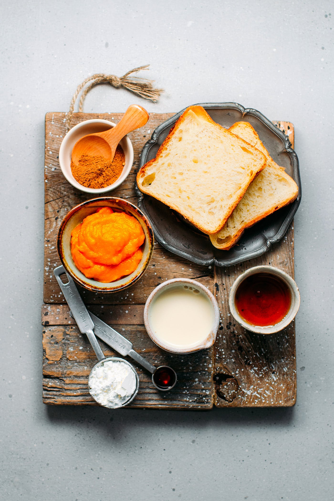 Ingredients like bread, pumpkin, and spices to make french toast