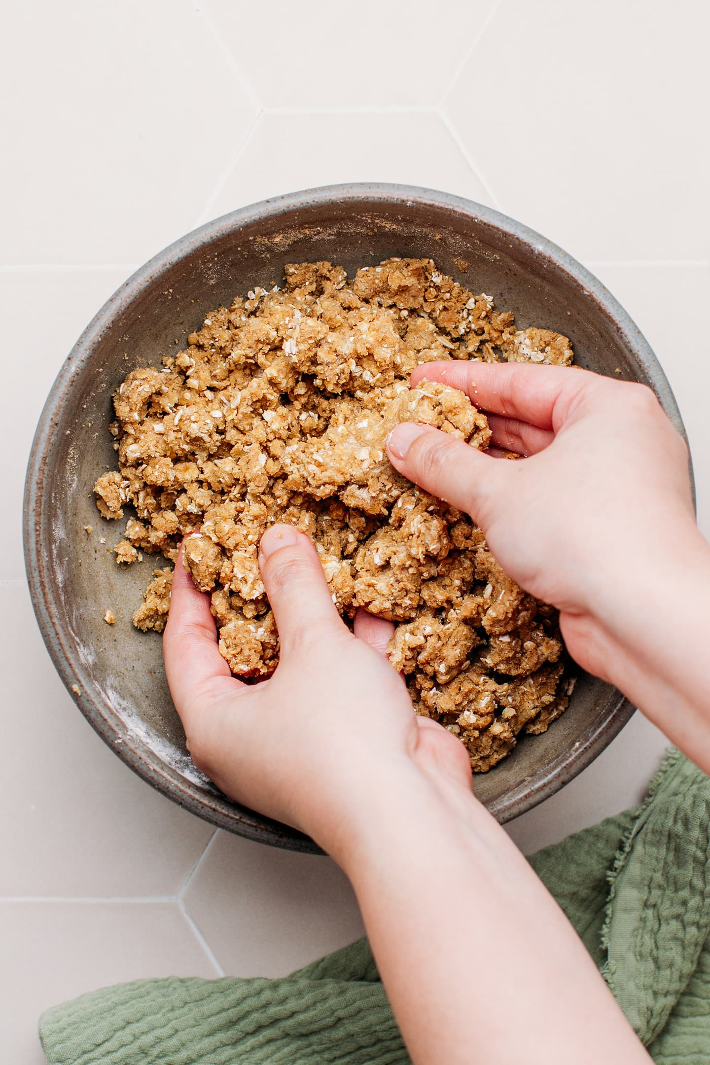 Preparing a crumble in a bowl.