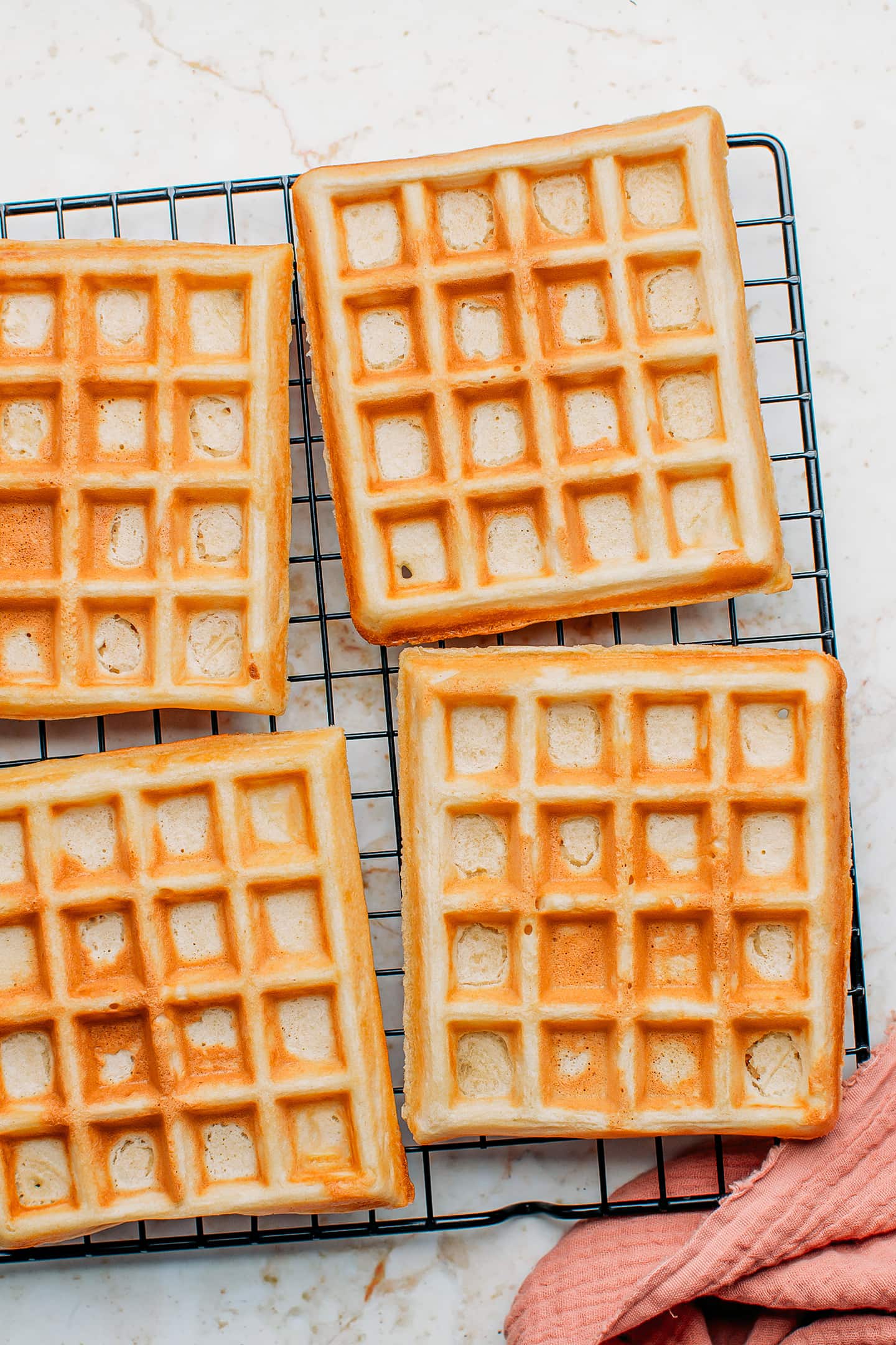 Vegan waffles on a cooling rack.