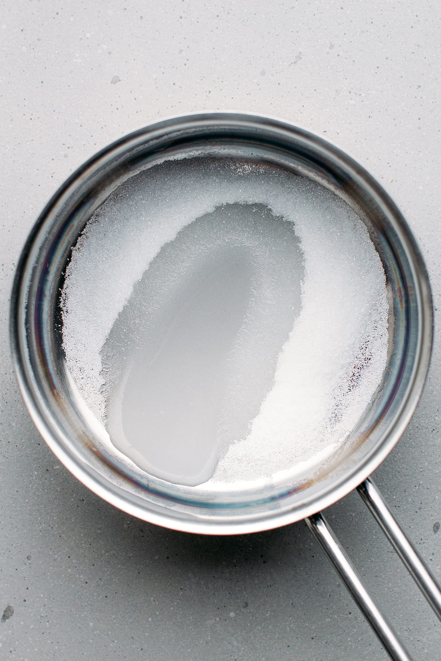 Sugar and water in a saucepan.