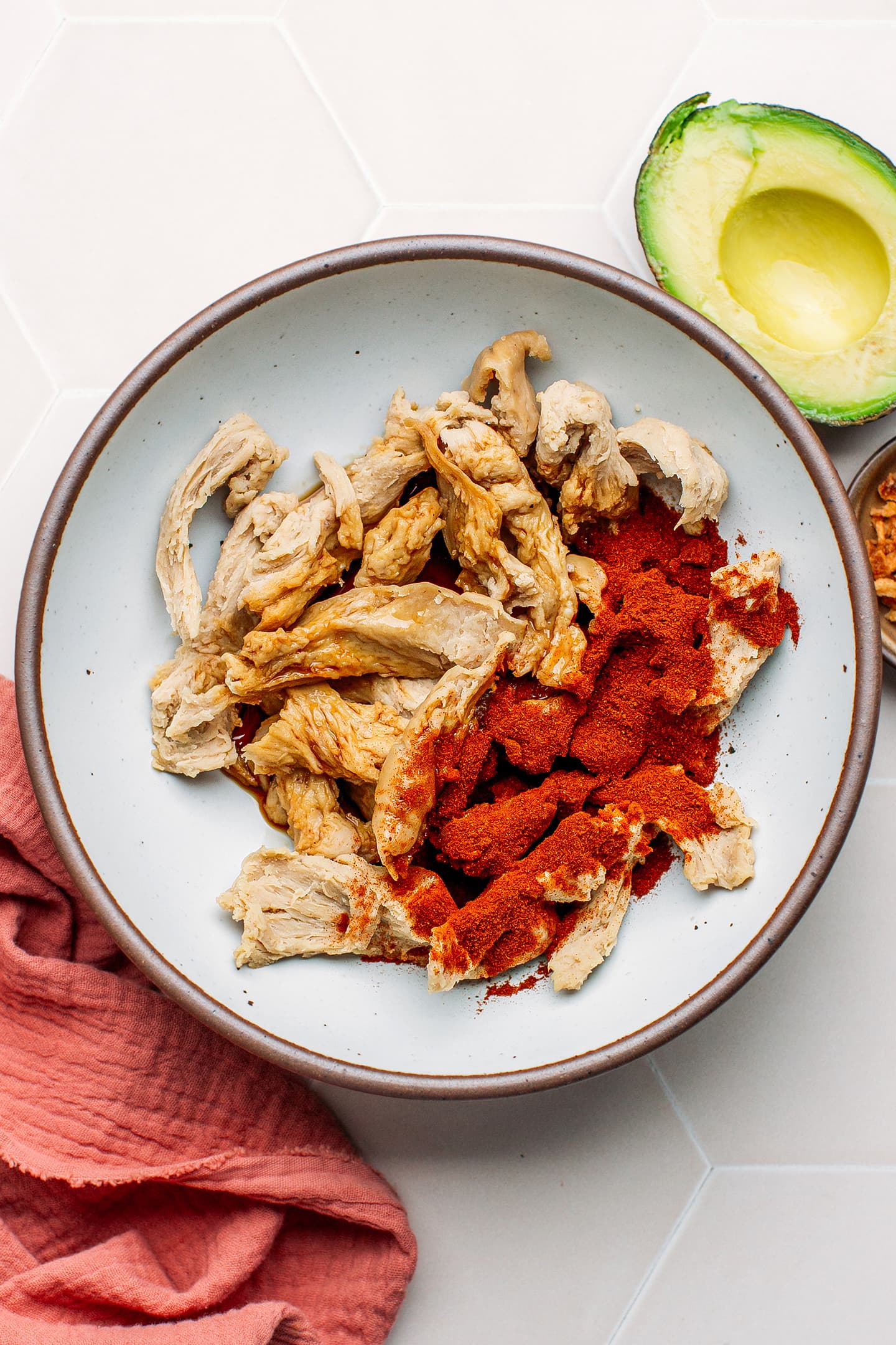 Vegan chicken strips and smoked paprika in a bowl.